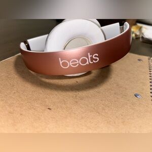 Rose gold wireless beats.